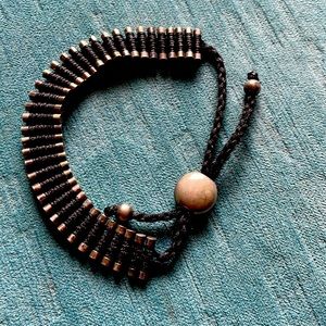 Silver and cord bracelet.